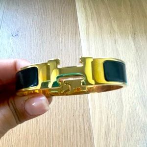 Gold and black enamel H cuff bracelet
